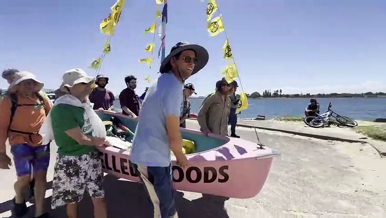 Rising Tide protesters carry their boat through a police line during harbour action in Newcastle | Newcastle Herald | November 22, 2024