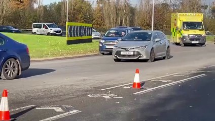 Ambulance passes through police cordon outside Gatwick Airport