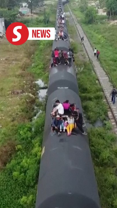 Migrant families risk life and limb to jump Mexico train in trek to border