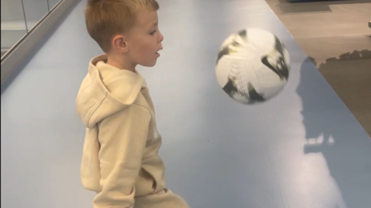 Little boy celebrates his 6th birthday with football kick-ups in Sports Direct