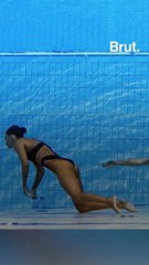 Coach dives into pool to rescue swimmer