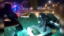 Moment, in dem ein Polizist aus Phoenix einen Mann rettet, der in einem Pool in seinem Auto gefangen war