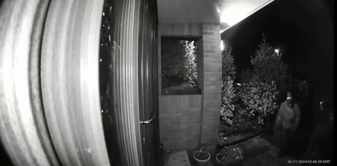 A Ring doorbell captures masked figures surveying a Sampford Peverell property