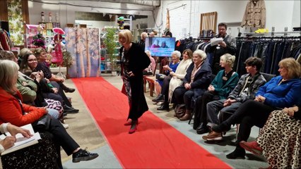 See staff, volunteers and service users model charity shop bargains on the red carpet at Guild Care superstore