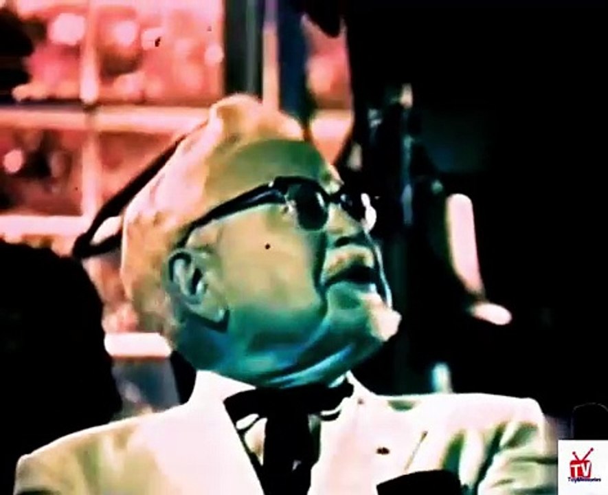 1970s Colonel Sanders at a firehouse TV commercial