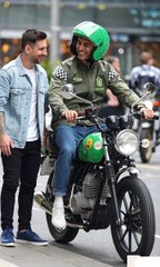 Messi and Ronaldo talking on the road