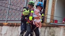 Baby stranded by flooding rescued in southern Thailand