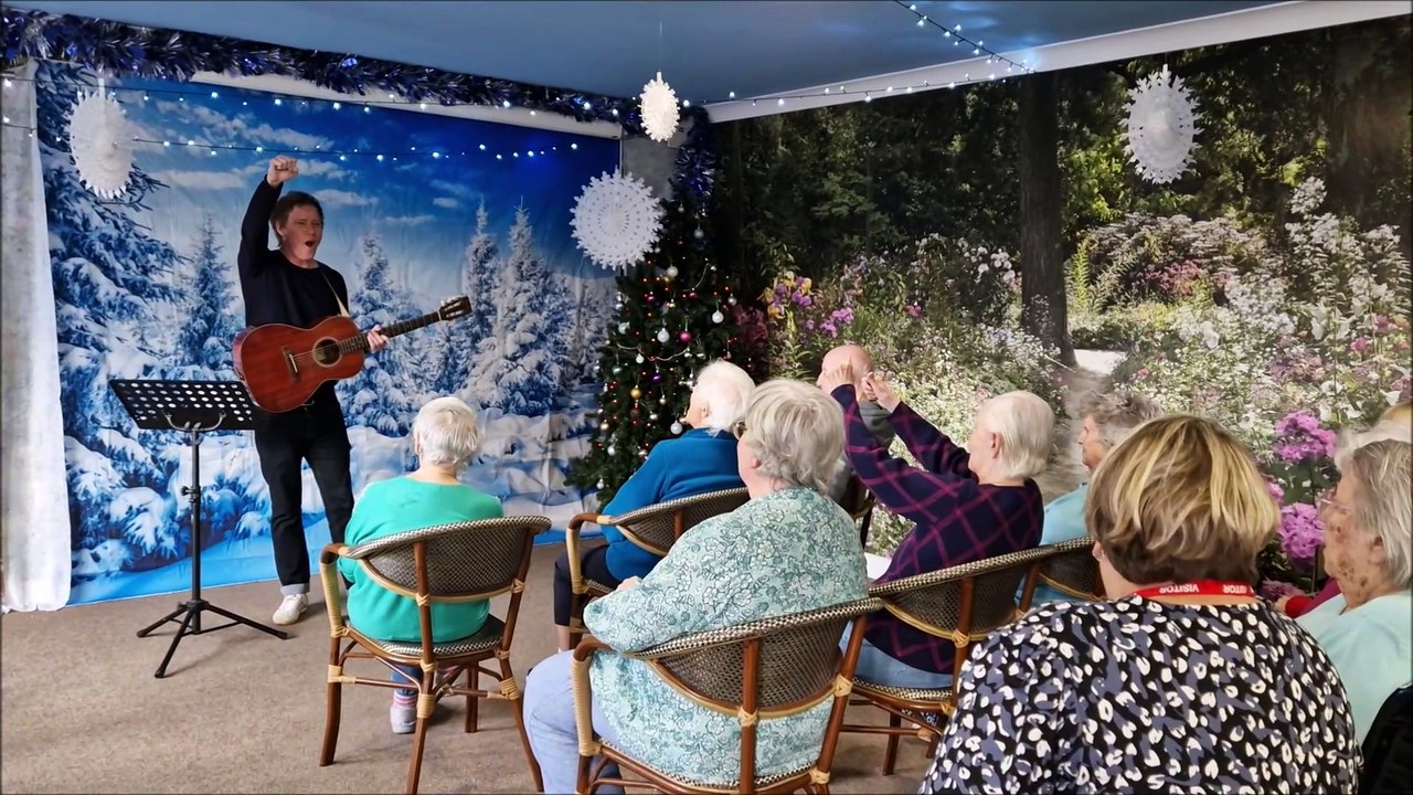 Worthing-born musician Chris Simmons performs his Chrismas single at Guild Care's Haviland House in Worthing
