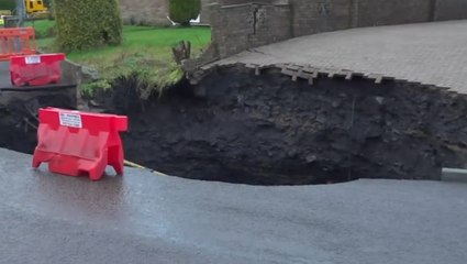 Moment 50ft sinkhole opens up metres away from Welsh house