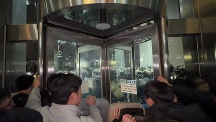 South Korean forces clash with crowds outside parliament after martial law declared