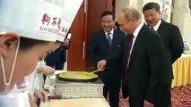 Russia's Putin and China's Xi Jinping learn to make Chinese dumplings _ VOANews