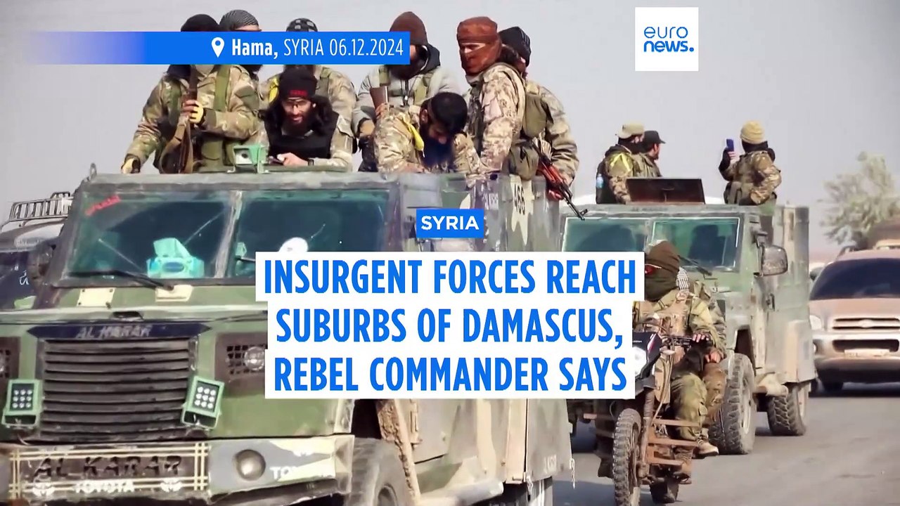 Syrian insurgents seize Damascus suburbs while state media deny Assad has fled