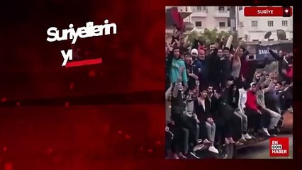 Suriyelilerin yıkılan Esad heykeli üzerindeki eğlencesi