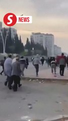 Elated prisoners pour out as Assad's jails flung open
