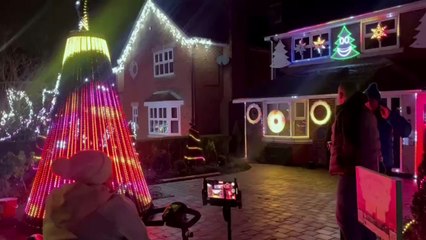 House decorated with dancing Christmas lights