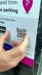 Fake QR code sticker on a car parking payment machine