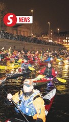 Kayaks light up Copenhagen canals in Santa Lucia procession