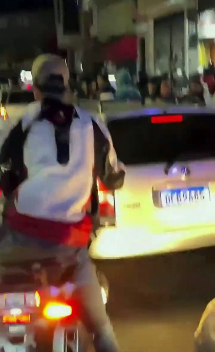 Biker weaves through highway traffic (video)