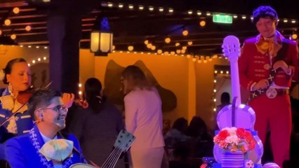 Bennett chats with Juan on Plaza de Coco Restaurant aboard the Disney Treasure