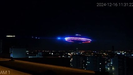 A fixed surveillance camera on a building in New York detects a flying saucer