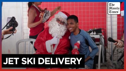 Santa swaps sleigh for jet ski to deliver presents in Brazil