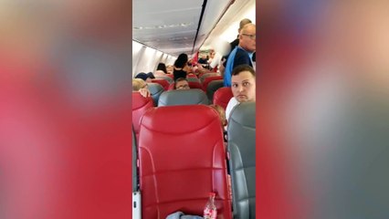 Fight on plane sees passenger bite another holidaymaker on the neck