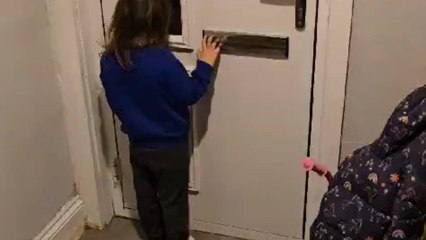Woman in elf costume tries to surprise her daughter after Christmas work but fails