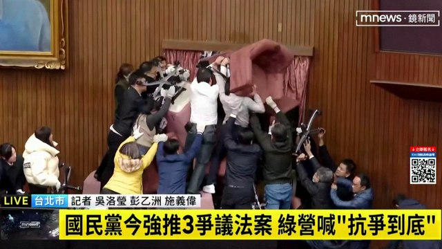 Taiwanese lawmakers engage in full-blown brawl during parliament session