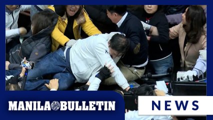 Taiwan lawmakers clash after one party breaks into legislature to occupy speaker's chair