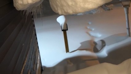 Incredible footage of snow hanging off roof after heavy weekend snowfall