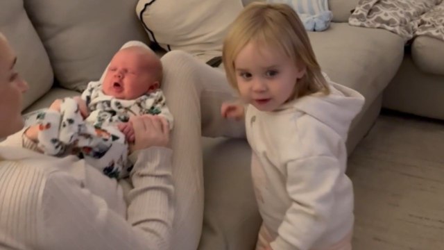 Over-protective sister refuses to share her baby brother with anyone, even dad