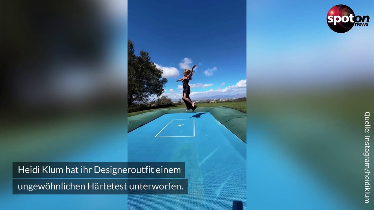 Heidi Klum testet ihr tief geschnittenes Kleid auf dem Trampolin