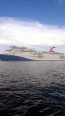 Container ship under bridge