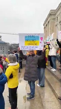 Protestors rail against President Donald Trump at State Capitol Tuesday