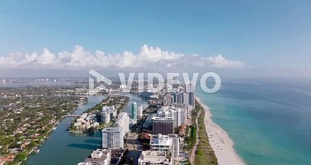 Aerial panoramic footage of tall modern buildings in urban borough on sea coast