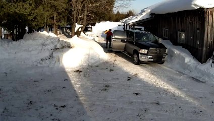 Snow Accumulated on Roof Falls Onto Man's Car