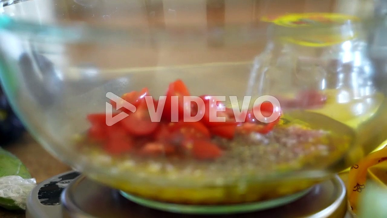 Adding fresh, chopped tomatoes to the homemade olive oil, vinegar, and shallot salad dressing - ANTIPASTO SERIES