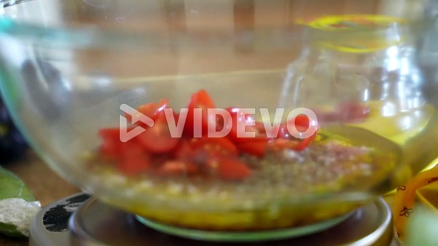 Adding fresh, chopped tomatoes to the homemade olive oil, vinegar, and shallot salad dressing - ANTIPASTO SERIES