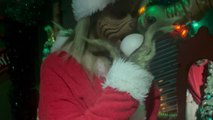 Grinch greets a family at Universal Islands of Adventure with sarcastic remarks