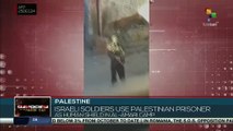 Occupation Army soldiers took a Palestinian prisoner as a human shield