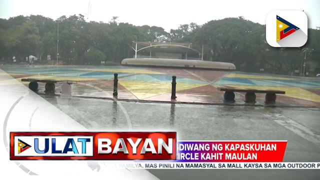 Ilang pamilya, piniling magdiwang ng kapaskuhan sa Quezon Memorial Circle kahit maulan