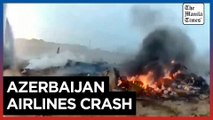 Emergency specialists work on site after Azerbaijani jet crashes in Kazakhstan