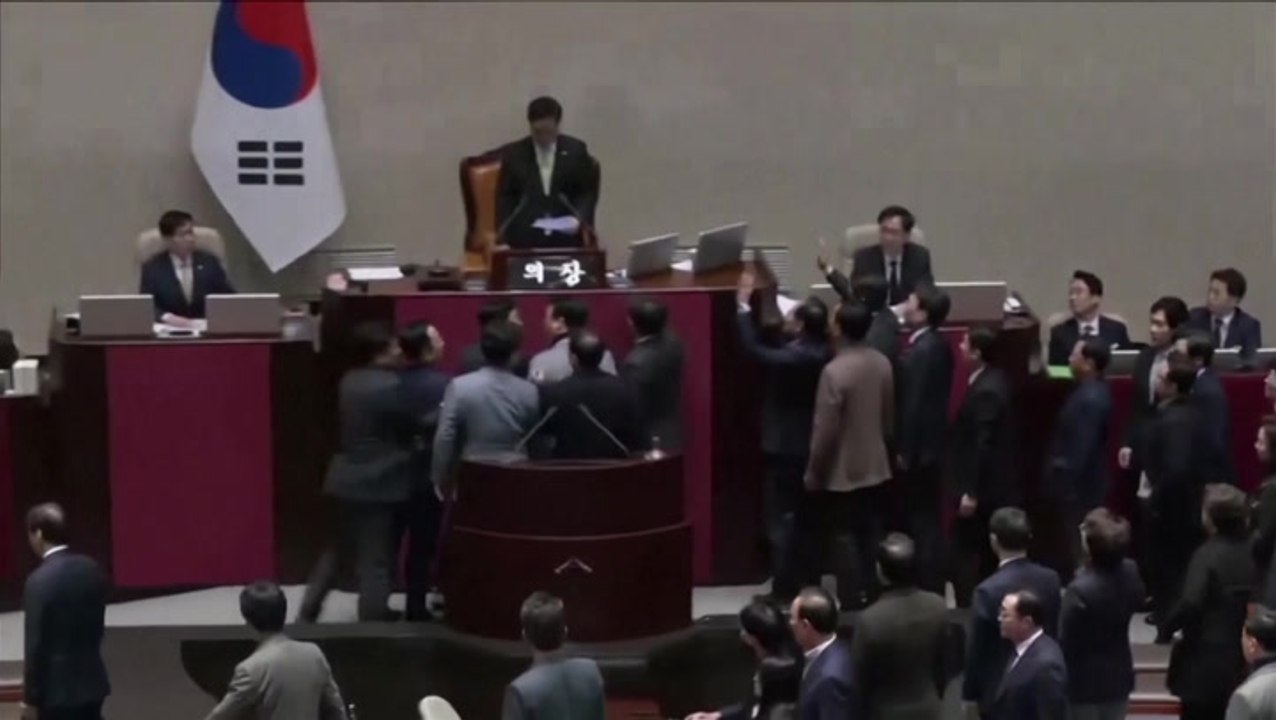 Chanting South Korean ruling party lawmakers swarm parliament in protest of impeachment vote