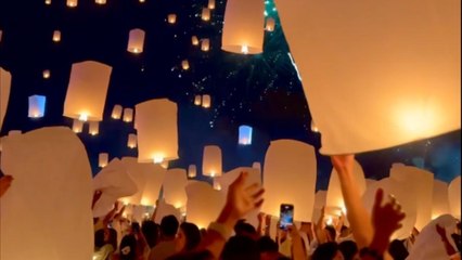 Lanterns rise high against the dark backdrop at Thailand Lantern Festival