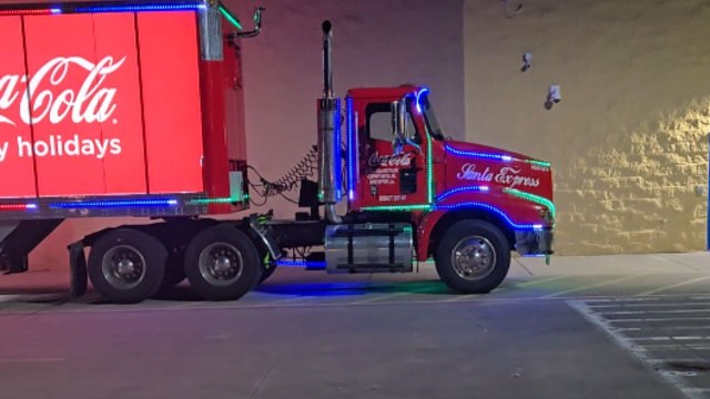 Man pleasantly surprised after coming across Coca-Cola Christmas truck at Walmart