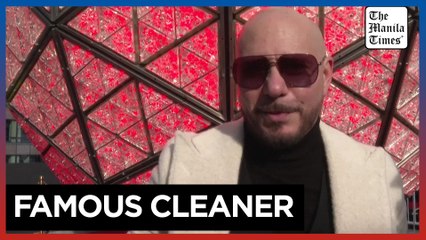 Pitbull helps clean and install new crystals on Times Square's New Year's Eve Ball