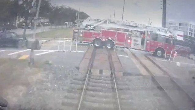 Watch: Passenger train drives into fire engine after it ‘drove through crossing gates’