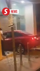 Drunk, unlicensed motorist crashes into bank door in Tawau