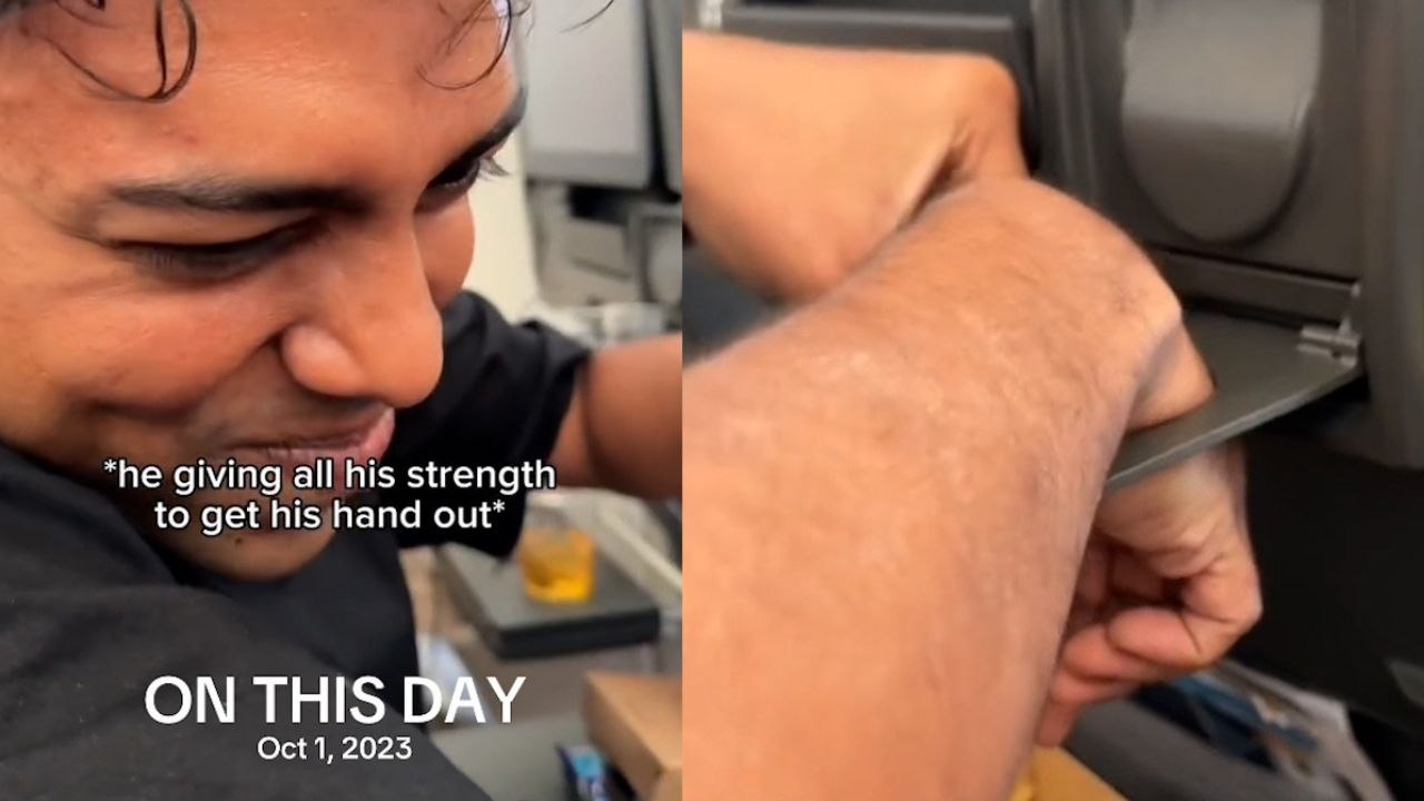 Passagier verblüfft die flugbesatzung, weil seine hand im becherhalter stecken bleibt