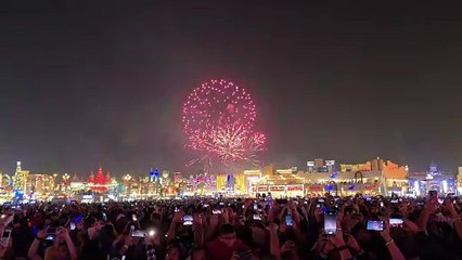 Clock strikes 12 in India, Global Village lights up sky